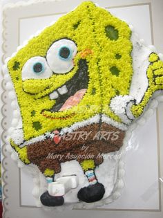 a spongebob cake is on display for someone to enjoy the dessert and it looks like they're ready to eat