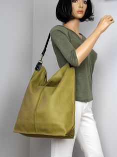 Green Leather Hobo Bag with Zipper,  Everyday Large  Slouchy Leather  Bag, Soft Leather Hobo Bag, Everyday Handbag for Women  **Dimensions Height: 18,5 inch (47 cm) Width: 18,1 inch (46 cm) Length of handle: 19,3 inch (49 cm) Bottom width: 13,4x 5,9 inch (34x15 cm) Internal pocket:  8,7x 6,7inch (22 x 17 cm) Large, very roomy bag made of thick yet soft cattle leather.  The bag can be worn as a shoulder bag. Detachable shoulder strap. There is a lot of space and you can put there everything in your everyday life. It has a top zip closure. Add this gorgeous bag to your collection!! To return to my shop, simply click here:  https://www.etsy.com/shop/BarbaraLeatherDesign Shipping: * Europe 2-7 days * USA 10-14 days * Other countries 10-20 days Soft Leather Rectangular Hobo Bag For Errands, Olive Satchel Shoulder Bag For Daily Use, Olive Satchel Bag For Everyday Use, Rectangular Soft Leather Hobo Bag For Errands, Olive Large Capacity Shoulder Bag For Travel, Large Capacity Olive Shoulder Bag For Travel, Green Hobo Bag For Everyday Use, Olive Shoulder Bag With Removable Pouch For Everyday, Green Hobo Shoulder Bag For Daily Use