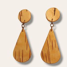 Post teardrop birch bark earrings are a stunning and minimalist jewelry accessory that features a teardrop-shaped birch bark pendant suspended from a post or stud earring base. These earrings combine the elegance of the teardrop form with the rustic charm of birch bark, resulting in a timeless and versatile piece of jewelry. The focal point of post teardrop birch bark earrings is the teardrop shape. The teardrop resembles a droplet or tear, creating a graceful and feminine appearance. The curved Birch Bark Earrings, Birch Bark, Xmas Crafts, Stud Earring, Natural Texture, Minimalist Jewelry, Rustic Charm, Timeless Style, Post Earrings