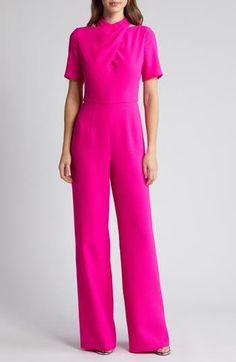 This textured crepe jumpsuit is designed with a twisted bodice, abbreviated sleeves and leg-elongating wide hems. 62" length; 35" inseam; 24" leg opening (size 8) Back zip closure Mock neck Short sleeves Partially lined 99% polyamide, 1% elastane Dry clean Made in the USA of imported fabric Silk Romper, Crepe Jumpsuit, Maxi Jumpsuit, Mesh Bodycon Dress, Black Halo, Jumpsuit Black, Mock Neckline, Sleeveless Jumpsuits, Short Jumpsuit