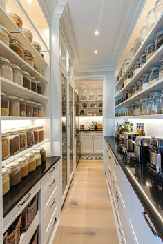 a kitchen filled with lots of open shelves