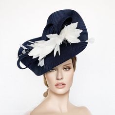 This fascinate hat is perfect for the Kentucky derby, Ascot races, weddings,  Belmont or Preak Hat or  any special occasion.The base measures 14" across and is held on by a thin black headband (with silicone ends to prevent a headache) and small comb. If you can custom the colours, the side to wear it or have any special questions please, contact me.* PROCESSING TIME: 1 - 10 business days.* DELIVERY TIME (DHL Express): 1-4 business days to all countries* Follow this link for more beautiful choic Derby Hats Diy Ideas, Derby Hats Diy, Fascinator Hats Outfit, Ascot Horse Racing, Navy Blue Fascinator, Wedding Hats For Guests, Feathers Wedding, Race Day Hats, Church Suits And Hats