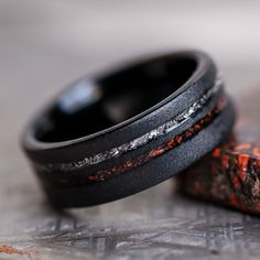 The Meteorsaur Dinosaur Bone and Meteorite Men's Wedding Ring from Thorum Horror Wedding, Meteorite Wedding Rings, Mens Wedding Rings Unique, Dinosaur Bone Ring, Wood Engagement Ring, Gibeon Meteorite, Mens Wedding Bands Unique, Bone Ring, Black Tungsten Rings