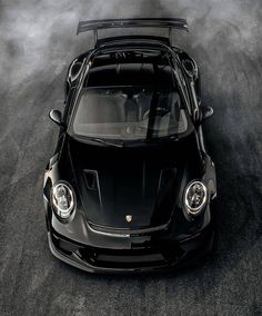 a black sports car with its hood open