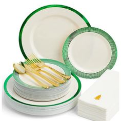 a stack of white and green plates with gold forks on each plate, next to a stack of folded napkins