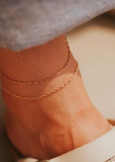 For the true minimalist. Delicate rectangle chain links create a simple but unique look. Available in 8.5-9" and 9.5-10". Available in 14kt Gold Fill + Sterling Silver. Shown with our Harlow Anklet. Handmade in Eau Claire, WI. Our jewelry is handmade so each piece will be unique and may vary slightly from what is pictured. Anklet Stack, Cute Texture, Copper Uses, Adornment Jewelry, Everyday Wear Jewelry, Be Unique, Chain Links, Sale Promotion, Jewelry Case