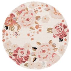 a round rug with pink flowers on it