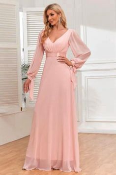 Dazzle in our Women's Pink Chiffon Lace-Up Long Sleeve V-Neck Evening Gown. This enchanting dress combines elegance with a touch of allure, featuring a graceful V-neck, delicate lace-up details, and flowing chiffon fabric. The long sleeves add a hint of sophistication, making it a perfect choice for formal events or special occasions. The soft pink hue adds a romantic touch, ensuring you stand out with timeless grace. Pink Chiffon V-neck Maxi Dress, Feminine Chiffon V-neck Dress For Wedding, Pink V-neck Chiffon Prom Dress, Feminine V-neck Chiffon Dress For Evening, Feminine V-neck Chiffon Dress For Wedding, Feminine Chiffon V-neck Wedding Dress, Pink V-neck Bridesmaid Chiffon Dress, Pink V-neck Chiffon Bridesmaid Dress, V-neck Chiffon Dress For Banquet