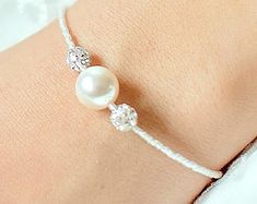 Bridal bracelet Lea Pearl bridal bracelet bridal jewelry | Etsy Adjustable Pearl Embellished Bracelet, White Pearl Beaded Bracelet For Wedding, Wedding Pearl White Beaded Bracelets, Pearl Beaded Bracelets With Pearl Charm For Wedding, Adjustable Pearl Drop Bracelet For Weddings, Adjustable Pearl Embellished Bracelet For Wedding, Adjustable Pearl Wedding Bracelet, Wedding Bracelet With Pearl Drop, Pearl Drop Bracelet For Wedding