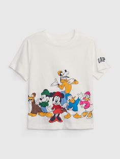 Made with 100% organically grown cotton.  Organic cotton is better for people and the environment because it's grown without the use of harmful synthetic pesticides and fertilizers.  Soft knit graphic T-shirt.  Crewneck.  Short sleeves.  Mickey Mouse and friends graphics at front.  Gap logo at sleeves.  Straight, easy fit.  Hits at the hip. Disneyland Family Shirts, Cute Disney Shirts, Toddler Tees Boy, Disney Bound Outfits Casual, Disney Themed Outfits, Baby Boy Tops, Disney World Outfits, Disney Bound Outfits, Cartoon Outfits