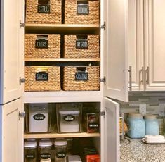 an organized pantry with baskets and labels on the shelves