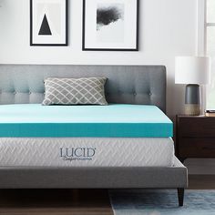 the lucd mattress is made up and ready to be used as a bed frame