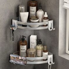 two shelves in the corner of a bathroom