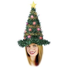 a woman with long red hair wearing a christmas tree hat on top of her head