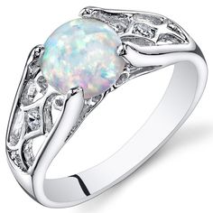 A little bit of whimsy. A little bit of confetti Our Opals are a multi-dimensional experience filled with joyful specs of confetti and a dash of whimsy.  This standout ring features a round shape Peora created Opal gemstone in .925 sterling silver. Responsibly sourced in every sense, our created Opal gemstones are physically, chemically, and optically identical to their natural counterparts. We're big fans of eco-luxury. Handcrafted in pure .925 sterling silver goodness, this ring has been carefully coated in an elegant rhodium finish. Our artisans are expertly trained in this process which fortifies the ring's strength, shine and brilliance. Main Stone Lab Created Opal 1.25 Carats, round shape, 7 x 7 mm White color with a SI1-SI2 clarity Metal .925 Sterling Silver 925 stamp, 2.3 grams Siz Fashion Rings Silver, Eco Luxury, White Opal Ring, Fire Opal Ring, Multi Dimensional, Opal Ring, Classic Ring, Silver Accents, White Opal