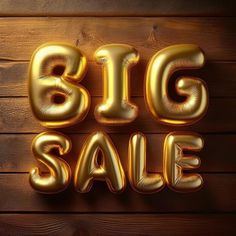 gold balloons spelling the word big sale on a wooden background