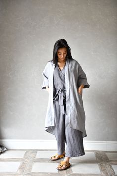 "ODETTE kimono linen coat is an asymmetrical design with two deep side pockets. This linen jacket is elegant, comfortable and so versatile - the design is available in 3 sizes. ODETTE asymmetrical linen jacket is not only comfortable but also eco-friendly and sustainable, making it the perfect choice for anyone looking to reduce their environmental impact. ▶ FIT ODETTE linen duster is of loose design and we offer it in 3 sizes. ▸ The model is wearing size S/M, color Light gray ▶ FABRIC: 100% lin Casual Oversized Kimono For Daywear, Casual Linen Kimono With Relaxed Fit, Oversized Casual Kimono For Daywear, Casual Linen Kimono For Spring, Spring Casual Linen Kimono, Oversized Linen Outerwear For Daywear, Spring Linen Wrap Outerwear, Spring Linen Outerwear With Kimono Sleeves, Fall Long Sleeve Linen Kimono