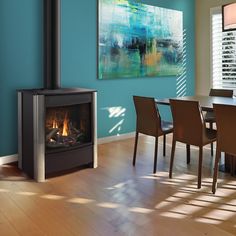 a living room with a fire place next to a dining table