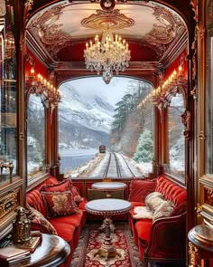 a train car with red couches and chandeliers