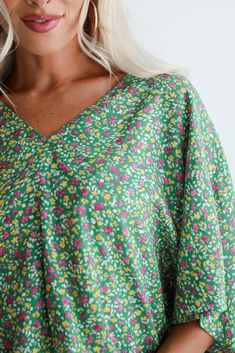 With the sun on your shoulders and wind in your hair, float through the day in the Perfect Whimsy Green Floral Oversized Blouse! Crafted from lightweight, breathable fabric, this blouse is perfect for adding a touch of botanical charm to your everyday style. The blouse features a delightful green hue that evokes a sense of tranquility and vitality, complemented by a vibrant floral pattern in shades of white, pink, and yellow. This intricate floral design adds a playful and feminine touch to the Floral Tops For Women, Oversized Blouse, Shades Of White, Pink And Yellow, Green Blouse, Tailored Trousers, Floral Blouse, Everyday Style, Linen Blend