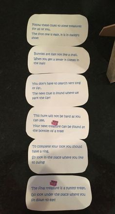 four white paper tags with words written on them