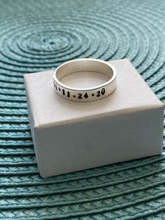 Sterling silver memorial ring personalized with a name, date of passing, inspirational phrase- perfect remembrance gift for men and women to honor a loved one. - Sterling silver, hand stamped band measures 6mm. - Personalize with up to 30 characters. -Hand stamped rings will stretch slightly when stamped, so more letters = more stretching. HOW TO ORDER: 1. Select Your Drop Downs. 2. Add to cart. 3. Leave me a note in the message to seller during checkout with your personalization up to 30 charac Personalized Silver Engraved Ring For Mother's Day, Personalized Silver Ring With Name, Personalized Stackable Rings For Anniversary, Personalized Round Band Stackable Rings For Anniversary, Silver Engraved Ring With Custom Name For Mother's Day, Silver Engraved Ring With Names For Gift, Customizable Engraved Ring For Anniversary On Mother's Day, Personalized Silver Rings For Anniversary, Customizable Engraved Ring For Anniversary And Mother's Day