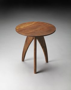 a small wooden table with two legs and a circular top, on a grey background