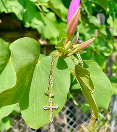 This stunning combination of pink and gold make this necklace so eye catching! Made with a 24K gold filled anchor link chain and a 14K gold-filled pink cubic zirconia cross pendant. It is affordable but looks very high quality! Quick Specs:  + 24k Gold filled chain  + 14k gold filled CZ Cross + Length: is 19.5 inches Pink Gold-plated Jewelry Tarnish Resistant, Tarnish Resistant Pink Gold Plated Jewelry, Pink Tarnish Resistant Gold Plated Jewelry, Pink Gold-plated Tarnish-resistant Jewelry, Pink Tarnish-resistant Gold-plated Jewelry, Gold Chain Cross Necklace For Gift, Pink Gold Plated Jewelry With Adjustable Chain, Pink Gold-plated Jewelry With Adjustable Chain, Pink Necklace With Gold Chain For Gift