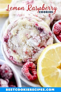 lemon raspberry cookies with powdered sugar on top and fresh berries in the background