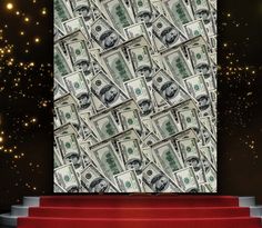 a bunch of money sitting on top of a red carpet next to a wall covered in stars