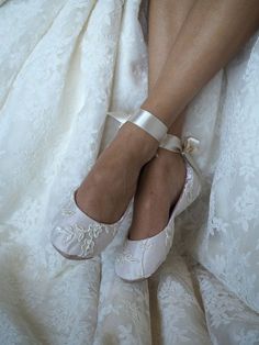 a close up of a person wearing wedding shoes