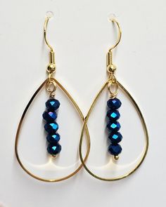 Unique handmade gold teardrop earrings with blue glass faceted beads. Earrings are very shiny. The length of earrings is approximately 43-44mm (whole length including the ear wire/hook), approximately 22mm wide. Made of high quality gold plated stainless steel, gold plated copper wire and glass faceted 4mm beads. Ear wires/hooks are made from gold plated stainless steel. Silicone earrings stoppers are included. Please note earrings can be slightly different to the photo as each jewellery piece i Faceted Beads Teardrop Earrings Gift, Gift Faceted Beads Dangle Teardrop Earrings, Gold Teardrop Beaded Earrings With Faceted Beads, Gift Dangle Teardrop Earrings With Faceted Beads, Gift Teardrop Hoop Earrings With Faceted Beads, Gold Teardrop Hoop Earrings With Dangling Beads, Gift Teardrop Dangle Earrings With Faceted Beads, Gift Teardrop Earrings With Faceted Beads, Gold Faceted Bead Drop Earrings