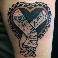 a black and white tattoo with an orange ribbon