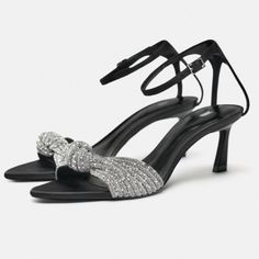 New With Tags Size 6.5 Mid-Height Heeled Fabric Sandals With Rhinestones. Front Knot Detail. Buckled Ankle Strap Closure. Heel Height: 2.4 Inches (6 Cm) Black | 1304/310 Sold Out Composition Upper 100% Polyester Lining 60% Polyurethane 40% Goat Leather Binm Zara Silver Open Toe Heels, Elegant Zara Heels With Rhinestones, Chic Embellished Evening Sandals, Glamorous Sparkling Evening Sandals, Elegant Sparkling Sandals For Cocktail, Sparkling High Heel Evening Sandals, Silver Embellished Sandals For Night Out, Evening Event Sandals With Rhinestones, Chic Bedazzled Sandals For Evening