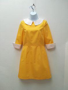 "ASHLEY DRESS Handmade dress 35%Cotton 65%Polyester Colors: yellow, white This dress is made under request, so there is no stock. Since is only made under request, can not be returned ( read my policies concerning conditions for exchanges or returns) CAN I CHANGE THE COLOR? YES Just add to your cart the listing special request, aswell for lining or other changes as alterations https://www.etsy.com/uk/listing/624364219/special-requests?ref=shop_home_active_1&frs=1 ARE YOU ON A RUSH? Do you ne Collared Yellow Dress For Work, Yellow A-line Retro Dress, Yellow Cotton Retro Vintage Dress, Yellow Fitted Mod Dress, Mondrian Dress, Mod Shift Dress, 60s Mini Dress, Mod Dress 60s, 1960s Mod