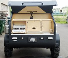 the back end of a truck with an oven in it