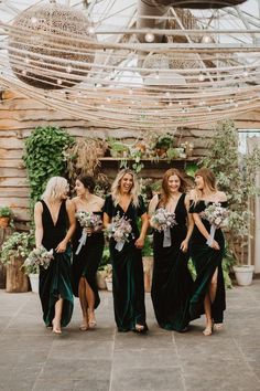 the bridesmaids are all dressed in black and green