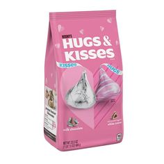 a pink bag of hugs and kisses cat litter with a silver foil cone on top