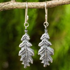 Thailand's Withaya Cheunjit shares the beauty of nature with earrings shaped like oak tree leaves. The sterling silver earrings are crafted by hand with oxidized contrasts. Earrings Exotic, Silver Dangle Earrings, Sterling Silver Cuff Bracelet, Sterling Silver Dangle Earrings, Sterling Silver Cuff, Silver Cuff Bracelet, Silver Earrings Dangle, Silver Cuff, Leaf Earrings