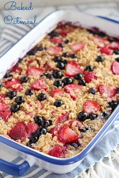 baked oatmeal with strawberries and blueberries in a casserole dish