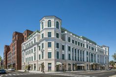 a large white building sitting on the corner of a street