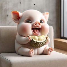 a little pig sitting on top of a couch with a piece of fruit in it's mouth