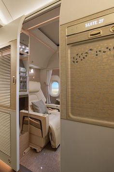 the inside of an airplane with its door open and windows opened to let in light