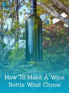 a wine bottle hanging from a tree in the middle of a yard with text overlay that reads how to make a wine bottle wind chime