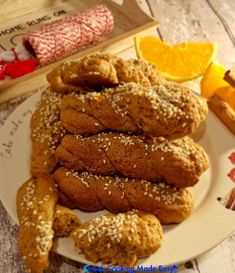 a plate full of cookies and orange slices