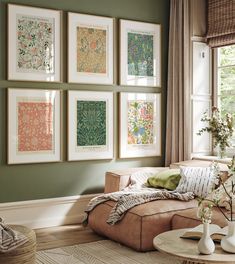 a living room filled with furniture and pictures on the wall above it's coffee table