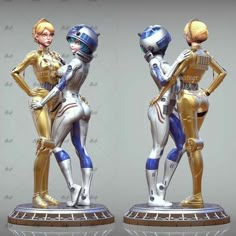 two figurines that are standing next to each other