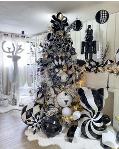 a christmas tree decorated with black and white ornaments