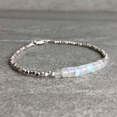 Rainbow Moonstone Bracelet | Natural Crystal Jewelry | Hill Tribe Silver Tiny Bead Bracelet | Dainty Genuine Moonstone Jewelry by GemsByKelley on Etsy https://www.etsy.com/listing/596364500/rainbow-moonstone-bracelet-natural Tiny Bead Bracelet, Hill Tribe Silver, Bracelet Dainty, Moonstone Bracelet, Moonstone Jewelry, Nature Bracelets, Moon Stone, Bead Bracelet, Rainbow Moonstone