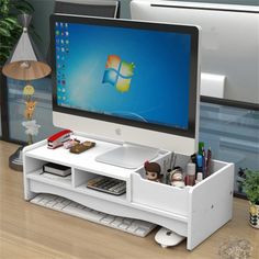 a desktop computer monitor sitting on top of a desk next to a keyboard and mouse